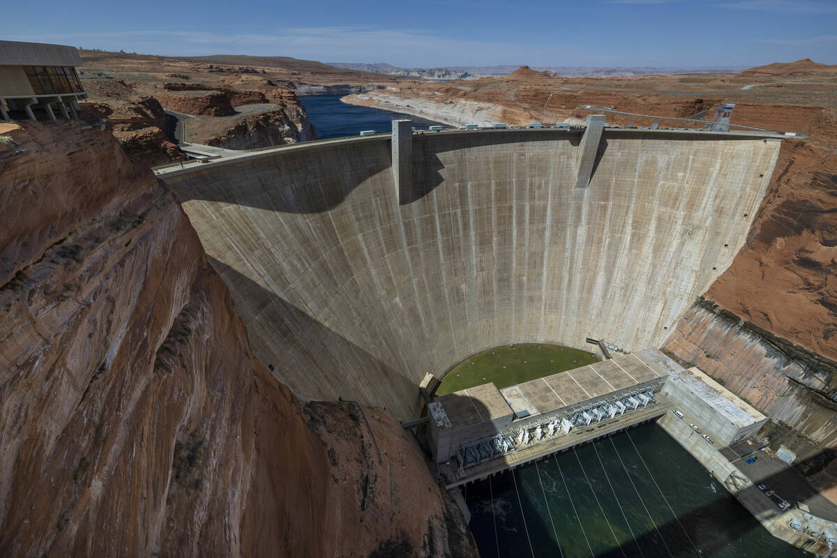 The Glen Canyon Dam with Colorado River flowing out below on Tuesday, April 18, 2023, in Page, ...