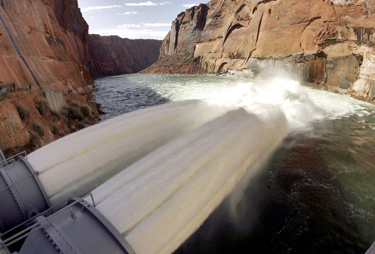Water flows from the number one and two jet tubes at the Glen Canyon Dam in 2008 in Page, Ariz. ...