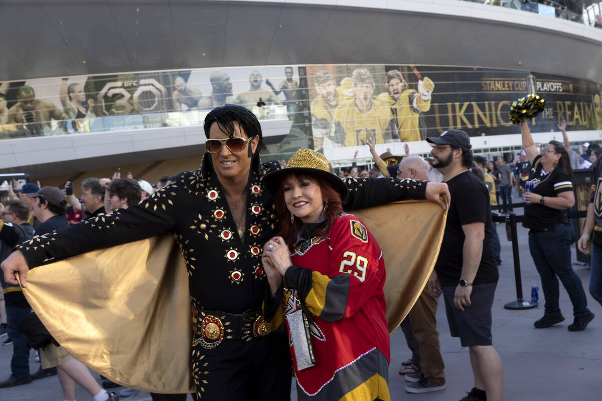 Golden Knights fan Sherry Jimenez poses for a photo with an Elvis impersonator before Game 5 of ...