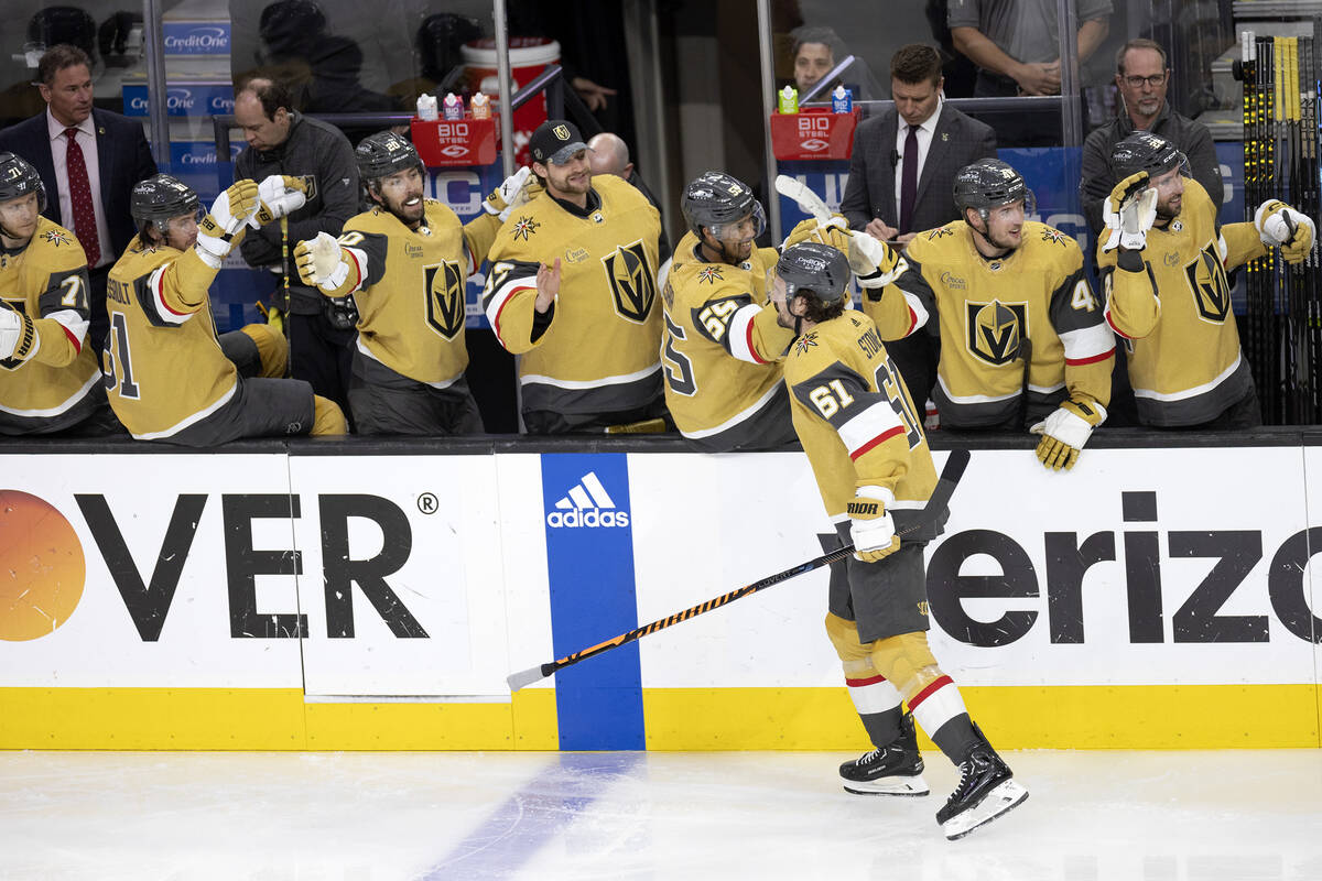 The Golden Knights bench congratulates right wing Mark Stone (61) on his goal during the second ...