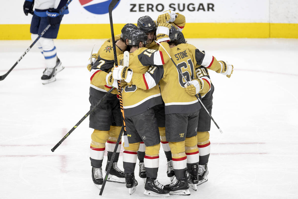 The Golden Knights celebrate after scoring during the second period in Game 5 of an NHL hockey ...