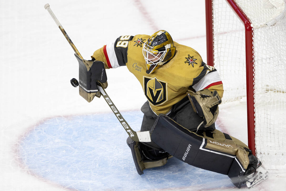 Golden Knights goaltender Laurent Brossoit (39) saves the puck during the third period in Game ...
