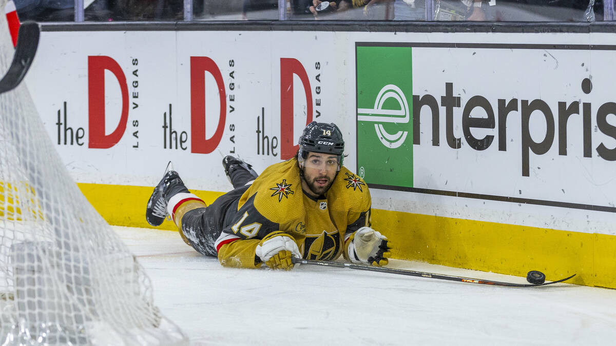 Golden Knights defenseman Nicolas Hague (14) looks up from being tripped by the Winnipeg Jets d ...