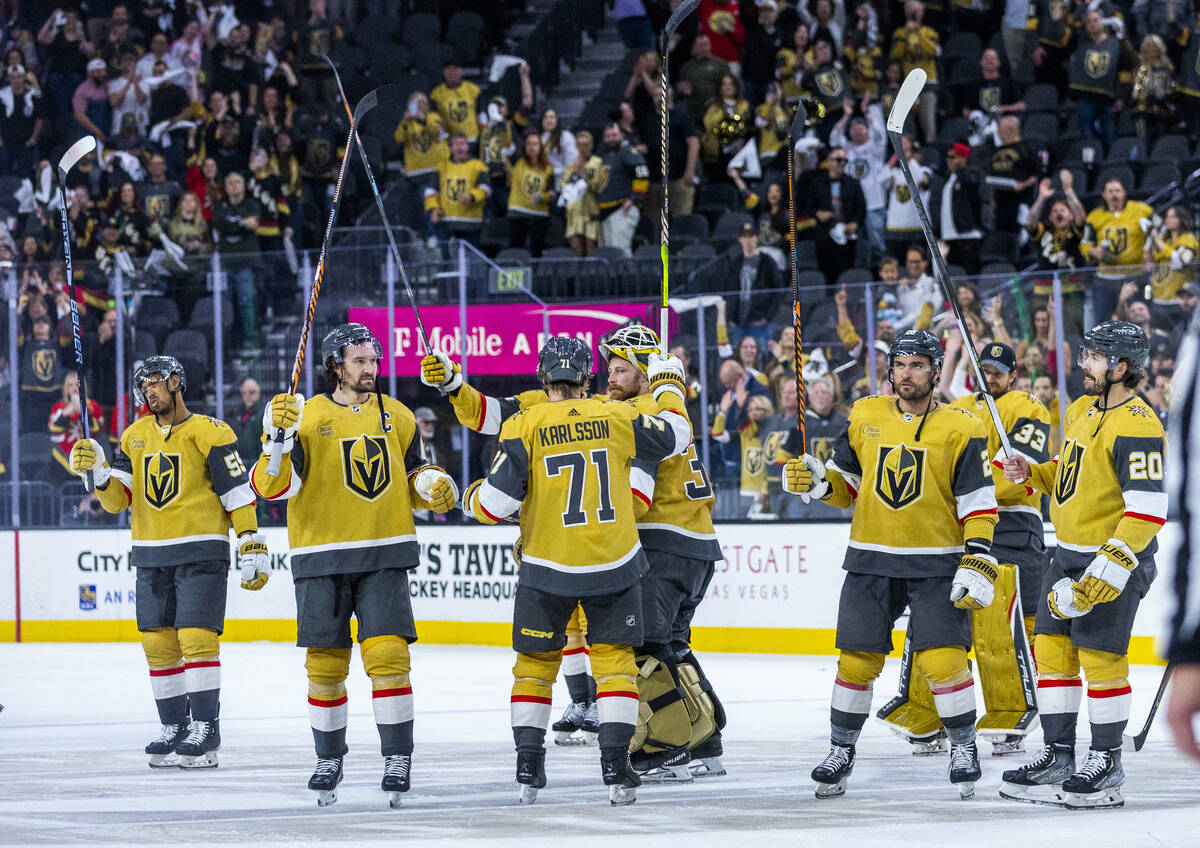 Golden Knights players celebrate with fans after defeating the Winnipeg Jets following the thir ...