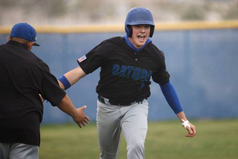 Green Valley's Brady Ballinger (7) celebrates his solo home run against Centennial during the f ...