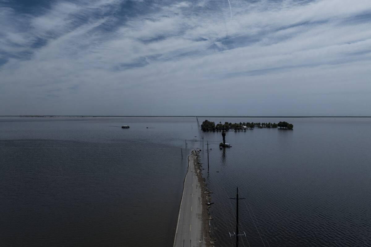 Farmland in the Tulare Lake Basin is submerged in water in Corcoran, Calif., Thursday, April 20 ...