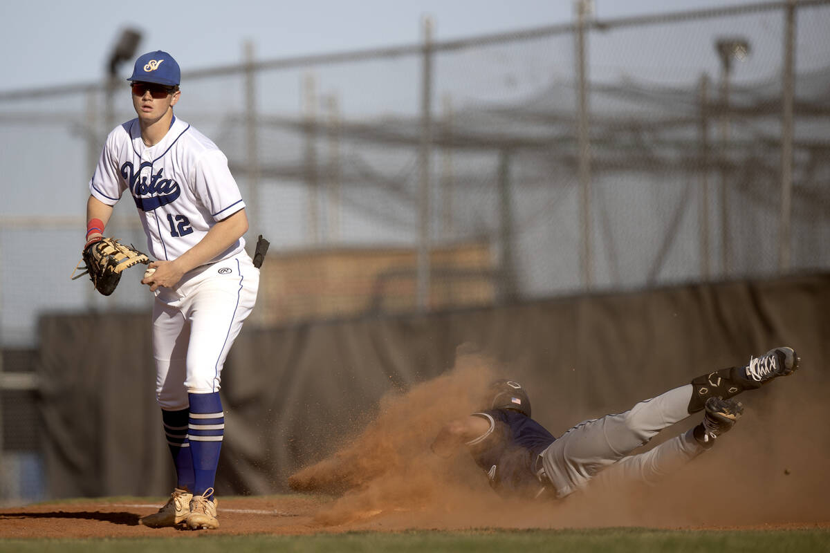 Sierra Vista first baseman Chase Frey (12) already made the out while Shadow Ridge’s Ty ...