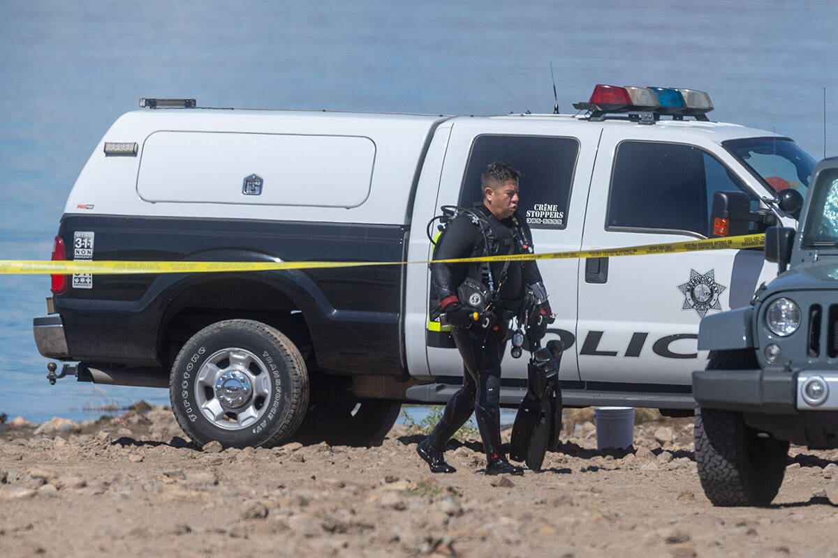 A diver leaves the water after human skeletal remains were found at Boulder Beach in the Lake M ...