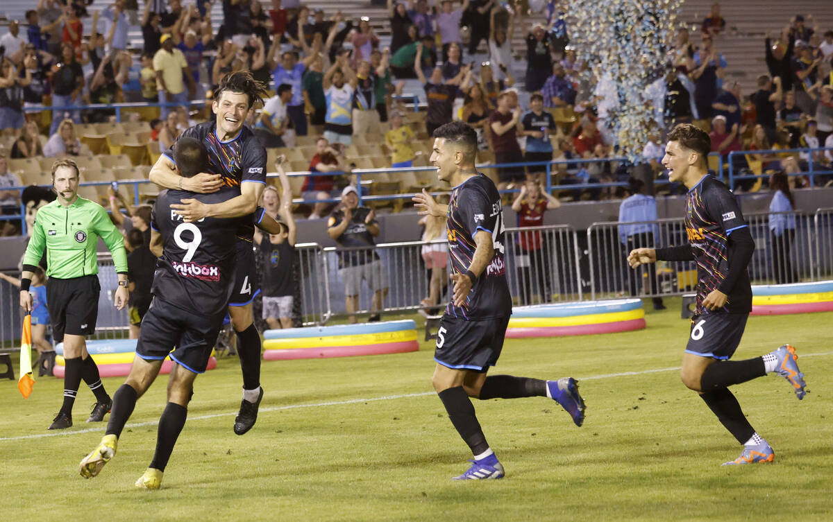 Las Vegas Lights FC defender Luke Stauffer (4) celebrates his goal with teammates during extra ...