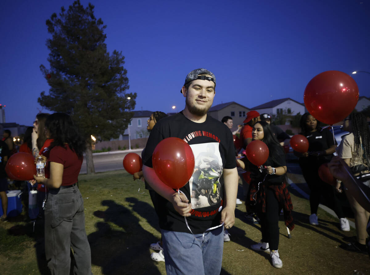 Jonathan Grace of Las Vegas holds a balloon before his brother Sonny Trushel’s memorial ...