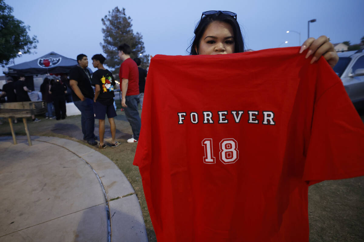 Melanie Totanes shows a T-shirt before Sonny Trushel’s memorial at Red Ridge Park, Frida ...