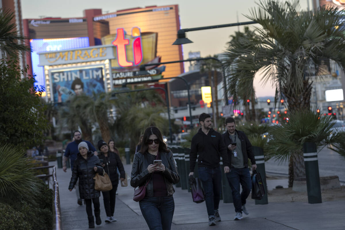 Pedestrians move along Las Vegas Boulevard on the Strip in November 2022 in Las Vegas. (Ellen S ...
