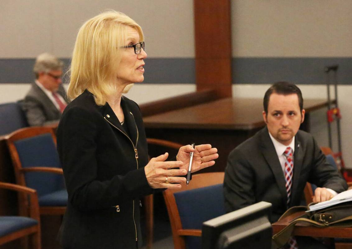 Samuel Warren, right, listens as Alice Denton attorney for Larry Bertsch, requests that Judge G ...