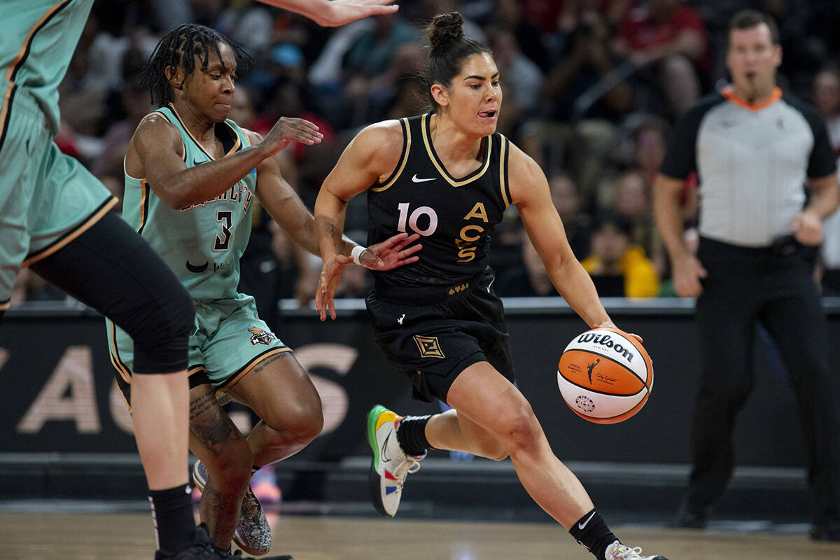 Las Vegas Aces guard Kelsey Plum (10) drives past the New York Liberty defense during the game ...