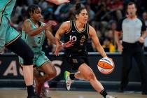 Las Vegas Aces guard Kelsey Plum (10) drives past the New York Liberty defense during the game ...