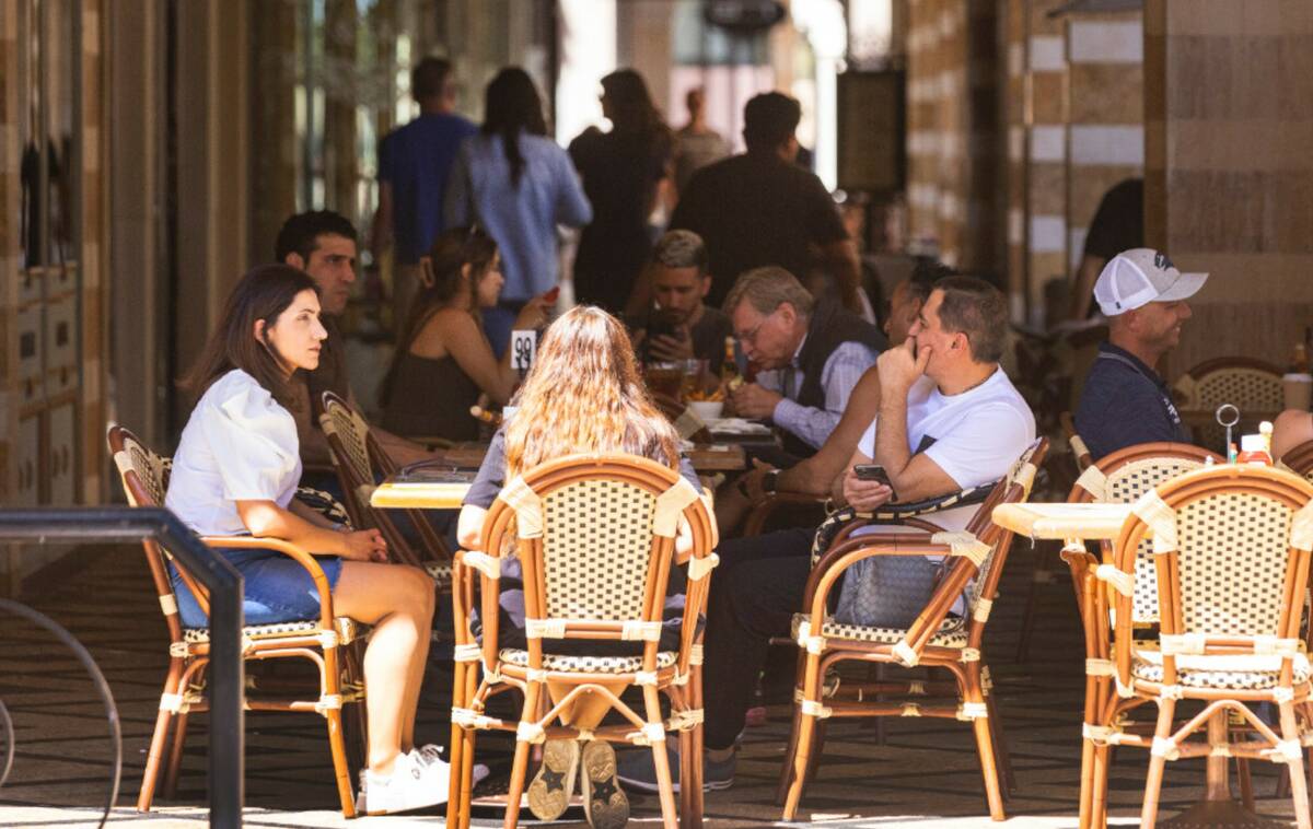 People sit on the patio as they enjoy their lunch at Leone Cafe, on Monday April. 24, 2023, in ...