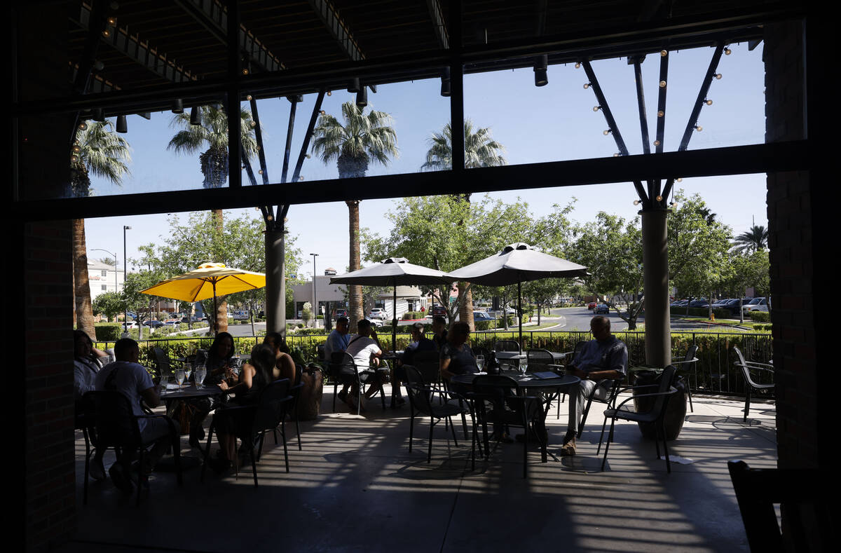 Customers sit in the patio at the Gordon Biersch brewery restaurant, Friday, April 28, 2023, in ...