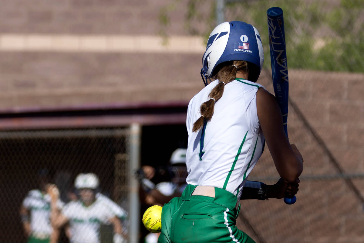 Green Valley second baseman Gabby Machida is hit by a Faith Lutheran pitch during a high school ...