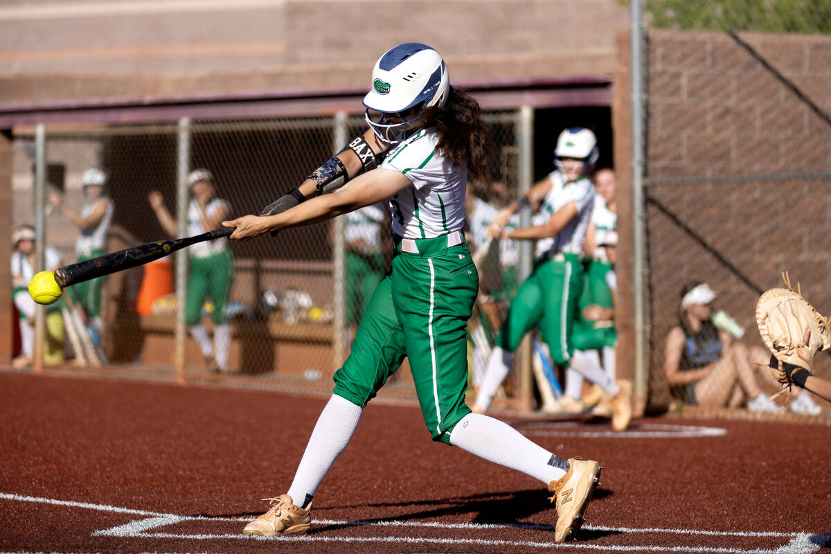 Green Valley right fielder Lila Baxter bats against Faith Lutheran during a high school softbal ...