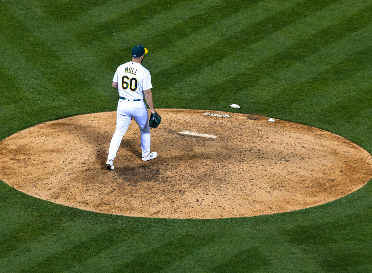 The Oakland A's pitcher Sam Moll (60) takes the mound at the Oakland Coliseum during a baseball ...