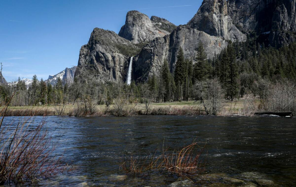 High water levels can be seen on the Merced River in Yosemite National Park, Calif., on Tuesday ...