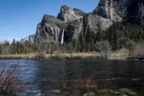 High water levels can be seen on the Merced River in Yosemite National Park, Calif., on Tuesday ...