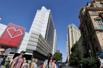 Pedestrians walk between the Horseshoe Las Vegas, left, and Paris Las Vegas on the Strip Friday ...