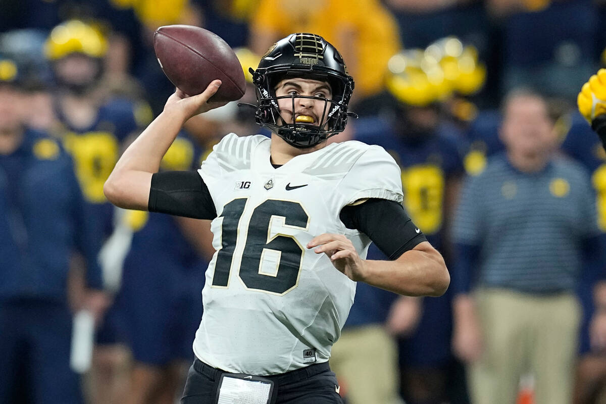 FILE - Purdue quarterback Aidan O'Connell throws during the first half of the Big Ten champions ...