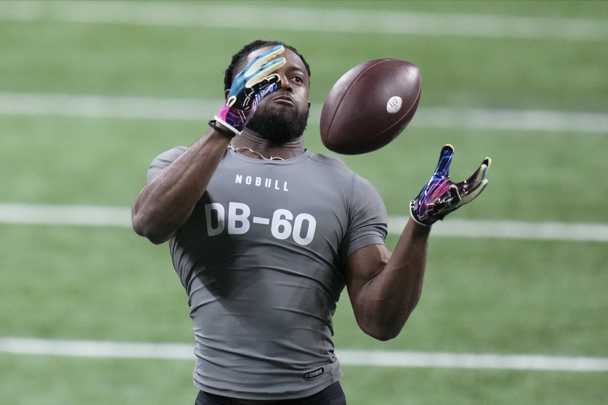 Georgia defensive back Christopher Smith II runs a drill at the NFL football scouting combine i ...