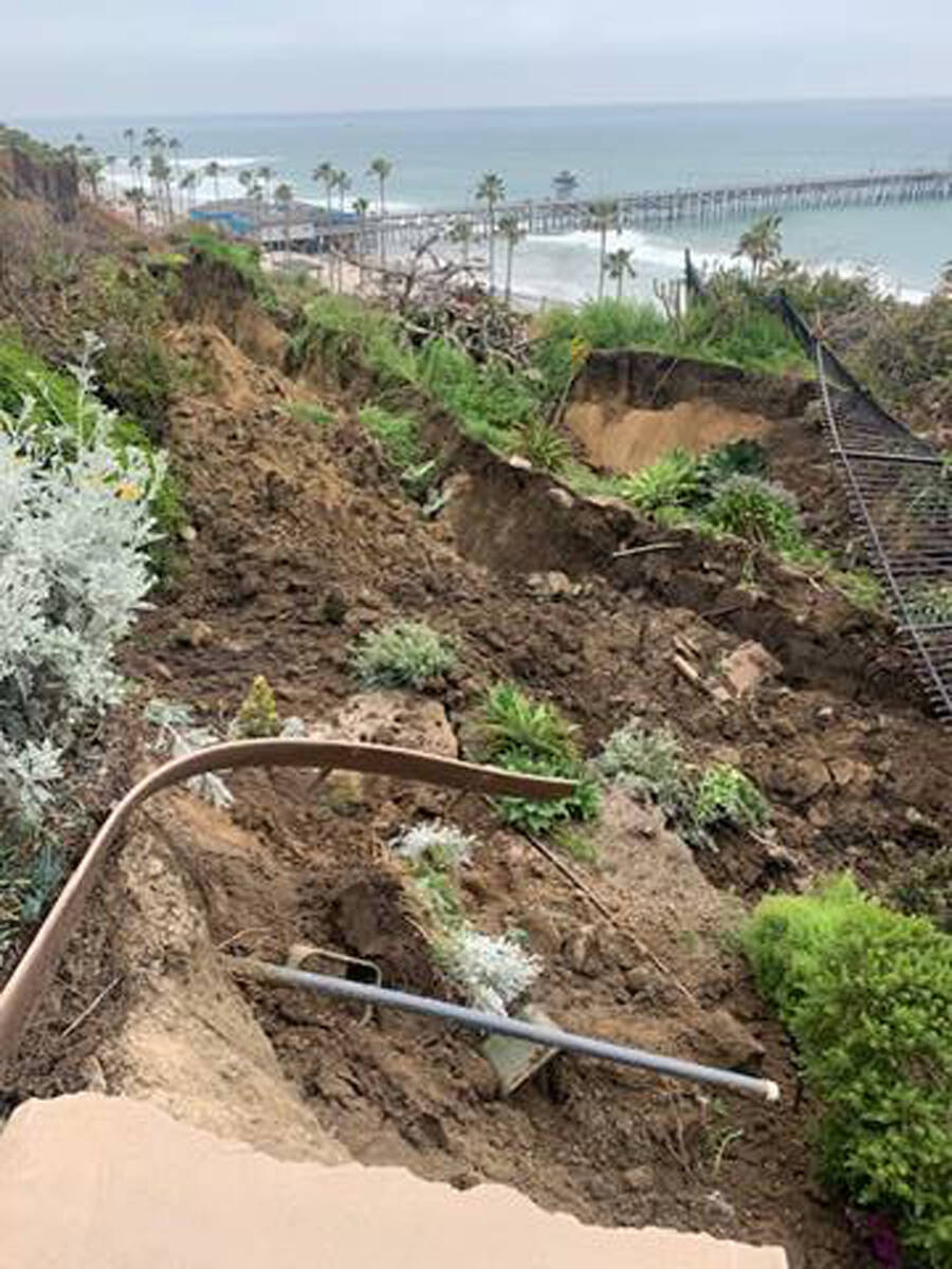 This photo provided by the City of San Clemente, shows damage from a landslide on the western s ...