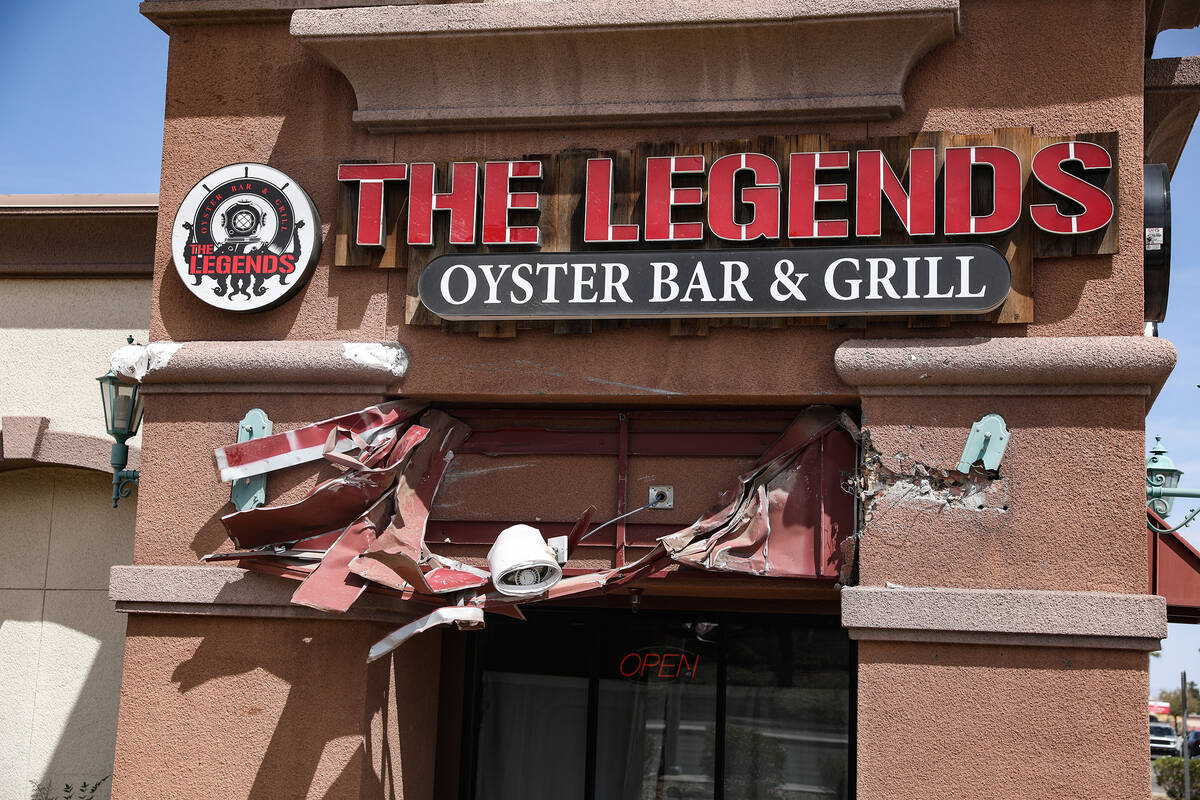 The scene of a fatal car crash outside The Legends Oyster Bar & Grill in Las Vegas, Sunday, ...