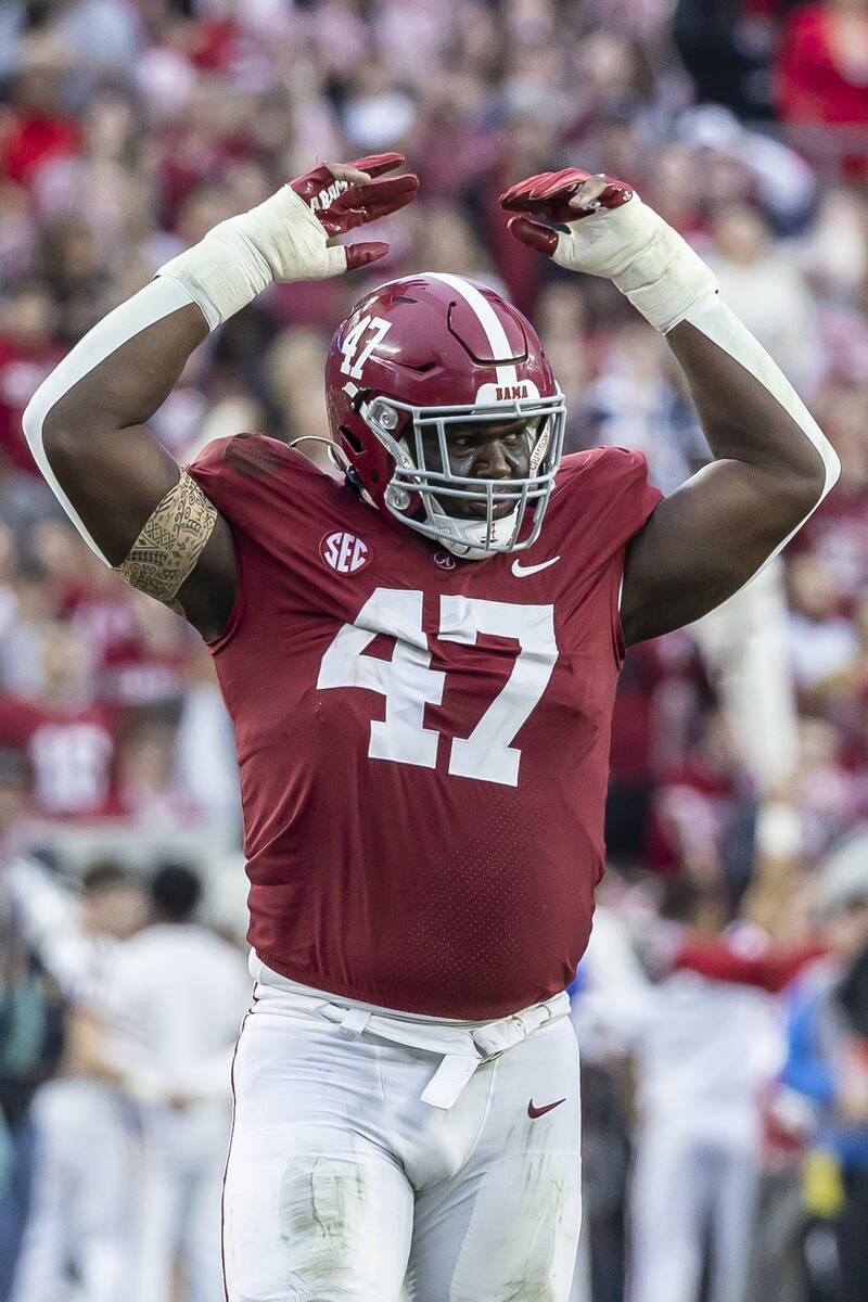 Alabama defensive lineman Byron Young (47) cheers the crowd during the first half of an NCAA co ...