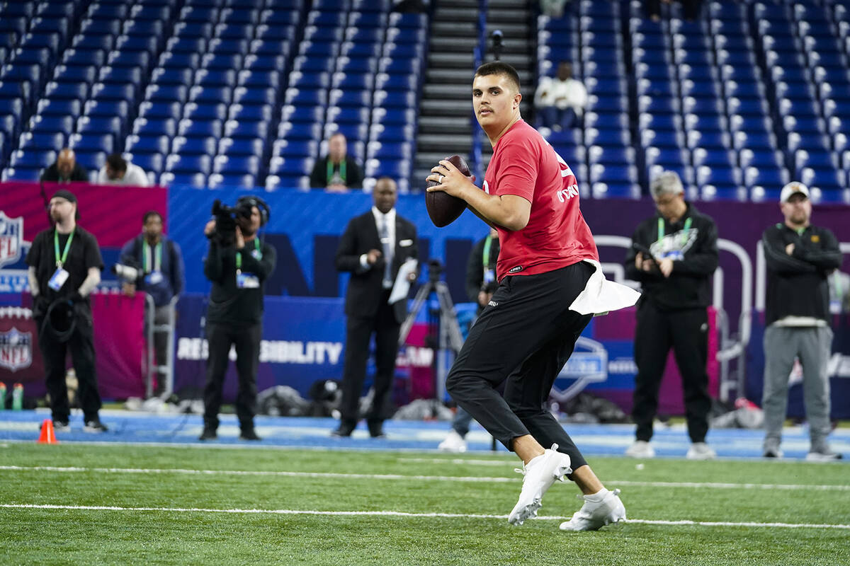 Purdue quarterback Aidan O'Connell runs a drill at the NFL football scouting combine in Indiana ...