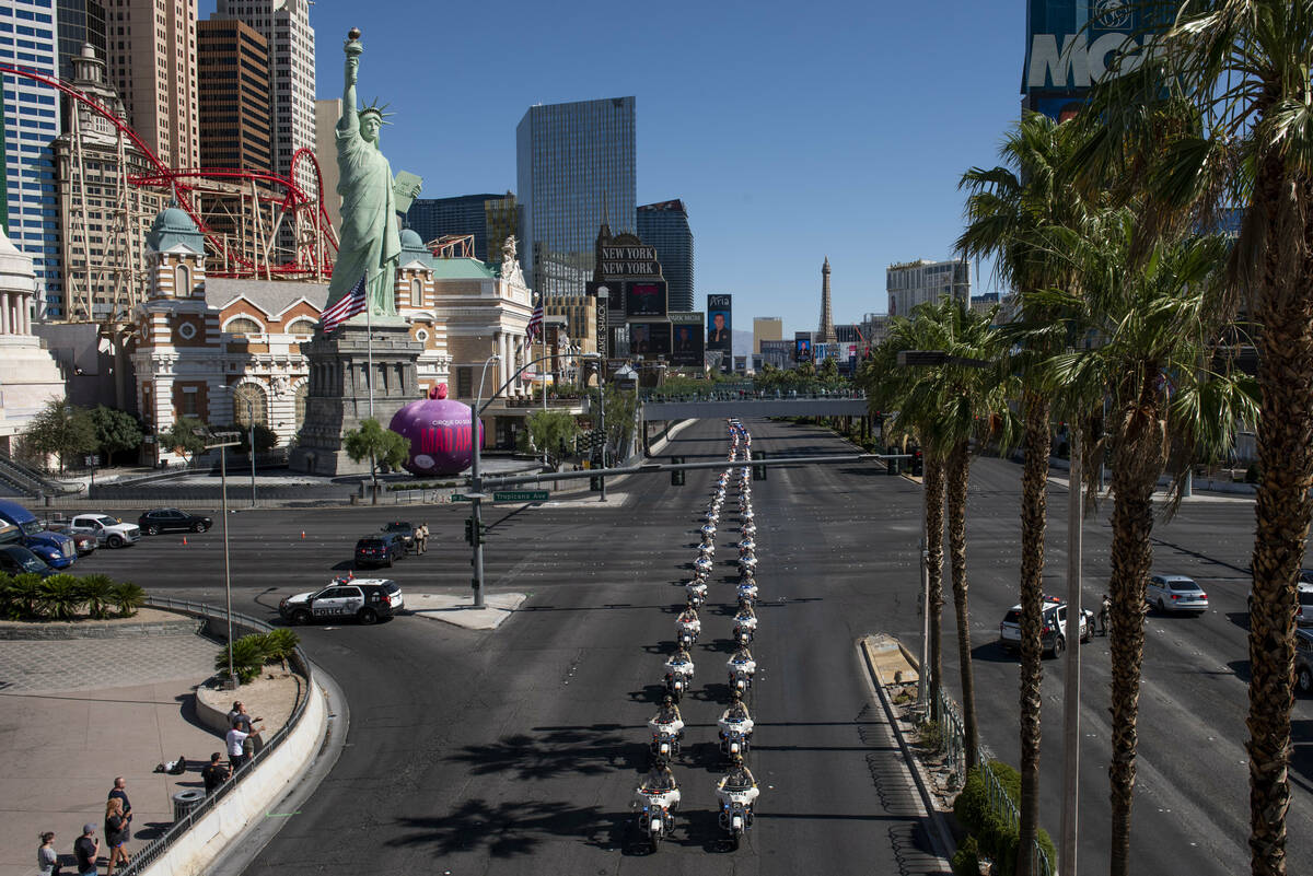 The funeral procession for Las Vegas police Detective Justin Terry heads southbound on Las Vega ...