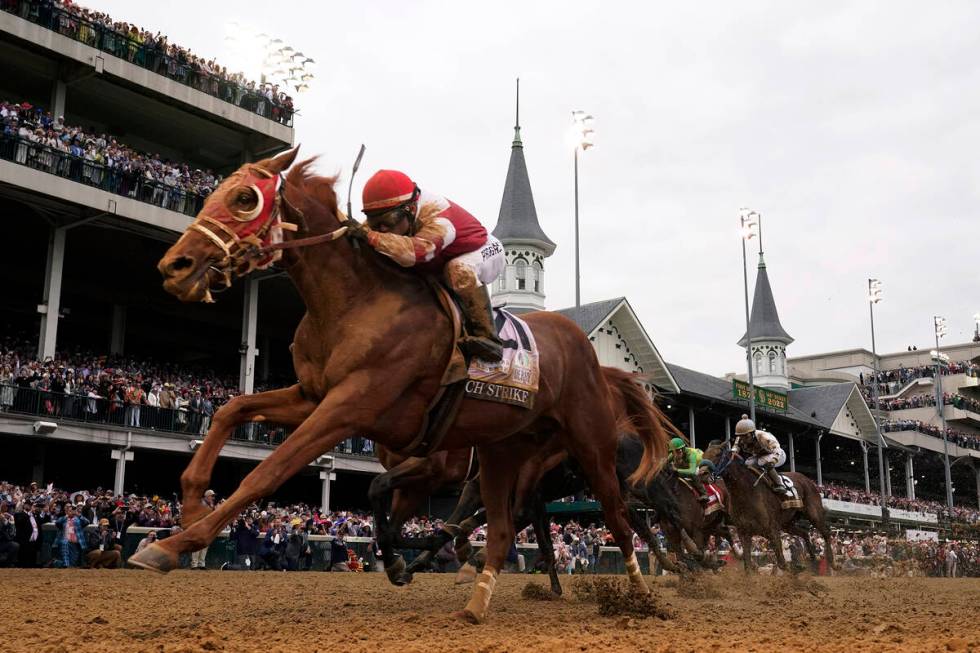 FILE - Rich Strike (21), with Sonny Leon aboard, wins the 148th running of the Kentucky Derby h ...