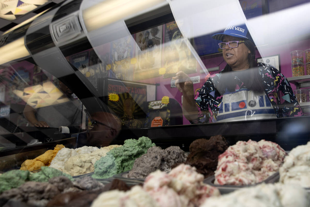 Zoe Gonzalez, owner of Up in Scoops, serves customers at the 1970s to 1990s-themed ice cream sh ...