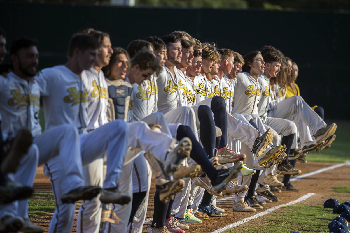 The Savannah Bananas team lines up along the first base line to perform a kick-line dance befor ...