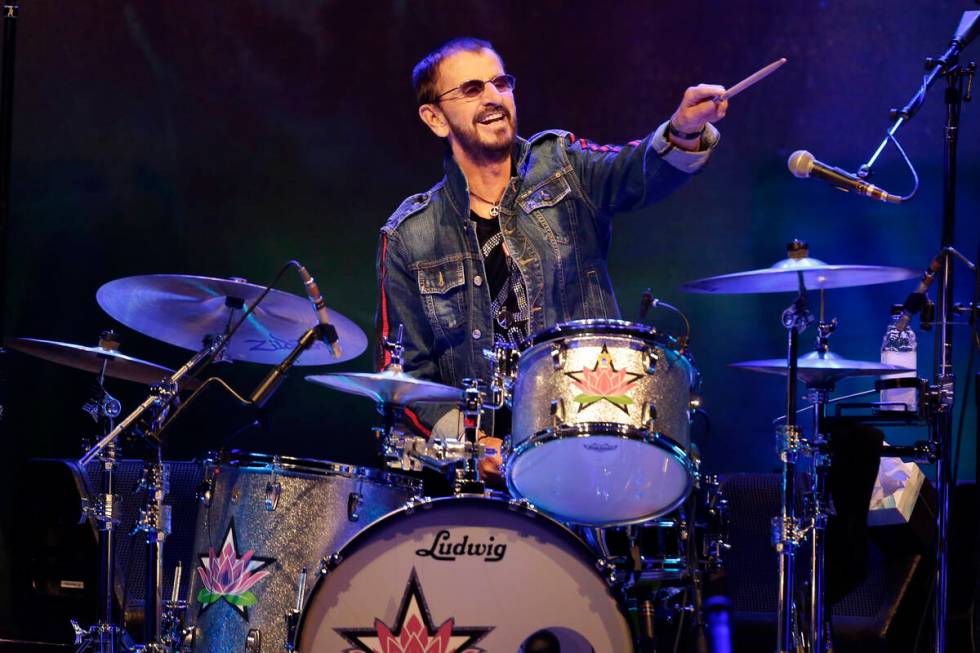 FILE - Ringo Starr plays as part of a concert celebrating the 50th anniversary of Woodstock in ...