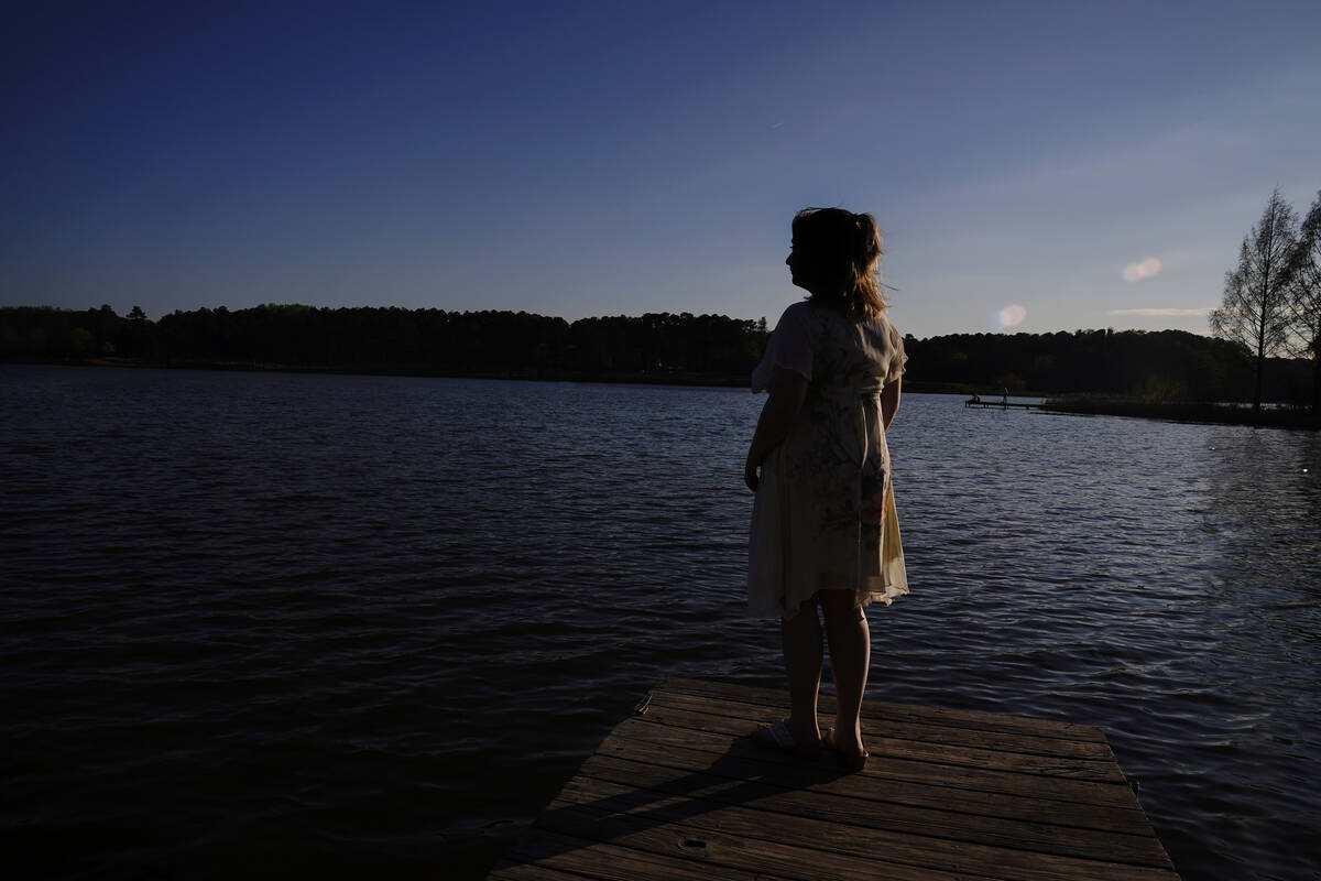 Emma, 18, stands for a portrait in Georgia on Thursday, March 23, 2023. The aspiring artist, wi ...