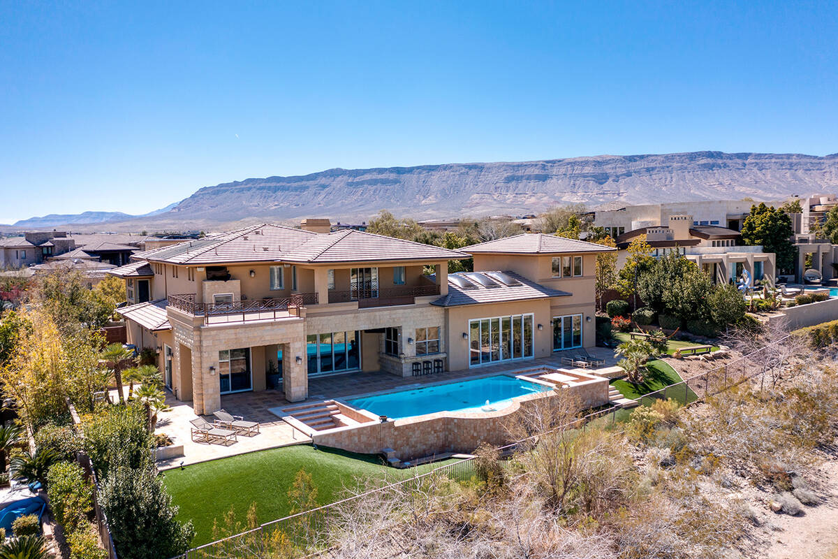 The home in The Ridges in Summerlin has views of the Strip and sits on sitting on Bear’s Best ...