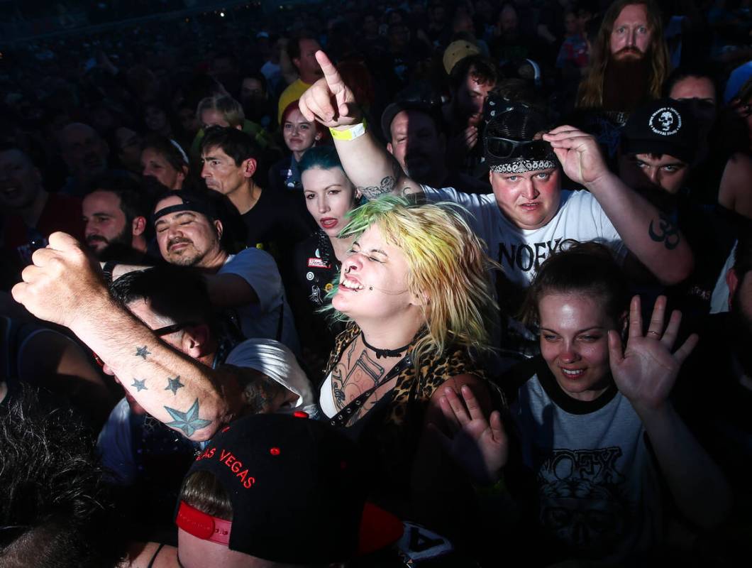 Attendees react as L7 performs during the first day of the Punk Rock Bowling music festival in ...