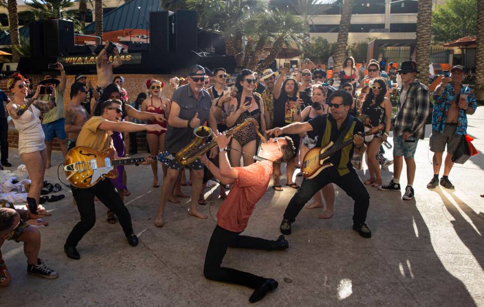 Joey and the Showmen perform in the crowd at the pool during the Viva Las Vegas Rockabilly Week ...