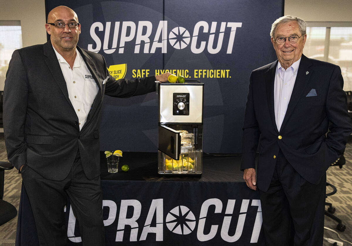 Kevin Szakacs, left, CEO and founder of SupraCut Systems International, and former Gov. Robert ...