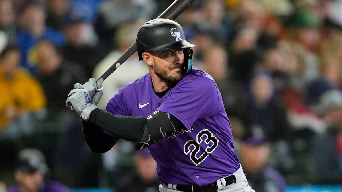 Colorado Rockies' Kris Bryant looks for a pitch against the Seattle Mariners during a baseball ...