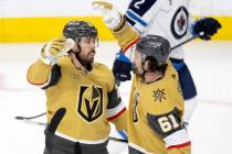 Golden Knights right wing Mark Stone (61) congratulates center Chandler Stephenson (20) on his ...