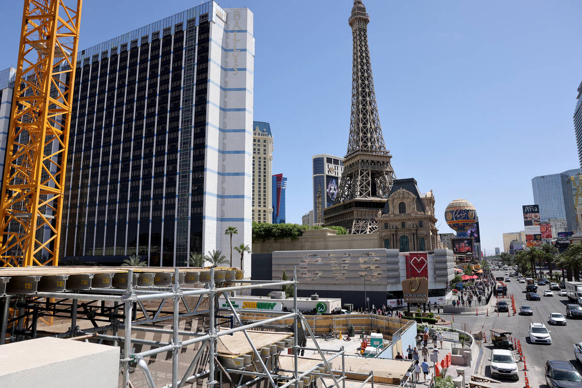 Pedestrians walk between the Horseshoe Las Vegas and Paris Las Vegas on the Strip Friday, April ...