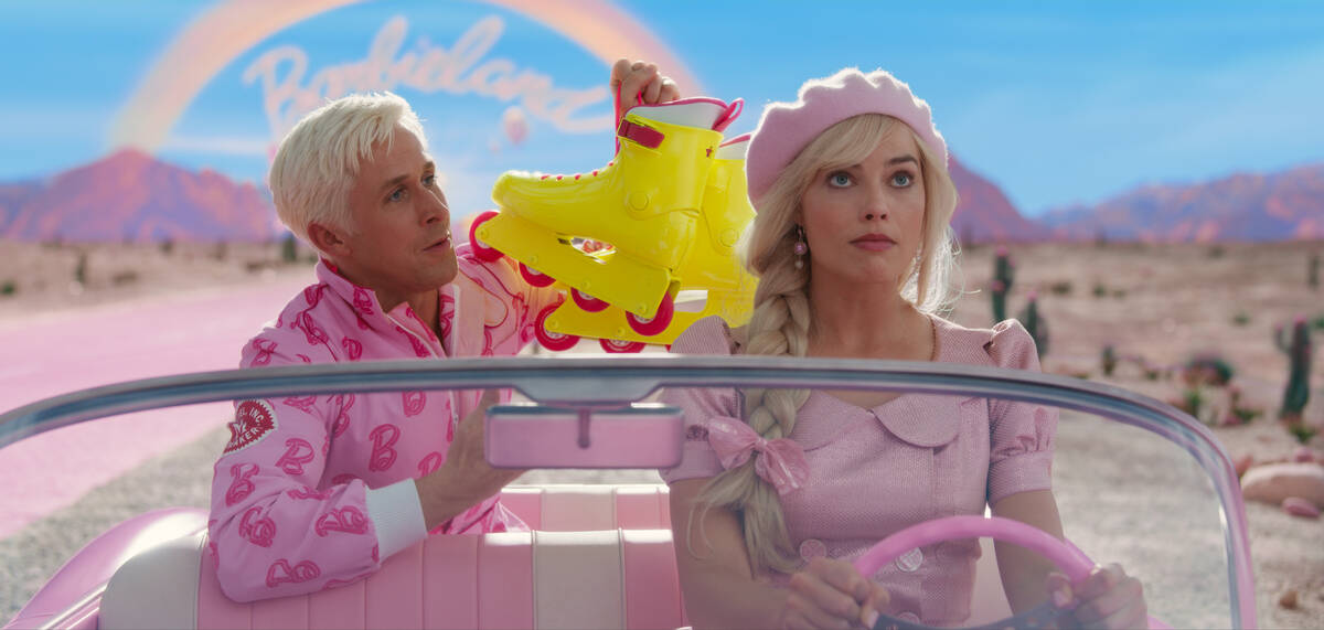 Ryan Gosling as Ken and Margot Robbie as Barbie in Warner Bros. Pictures’ “Barbie.” (Warn ...