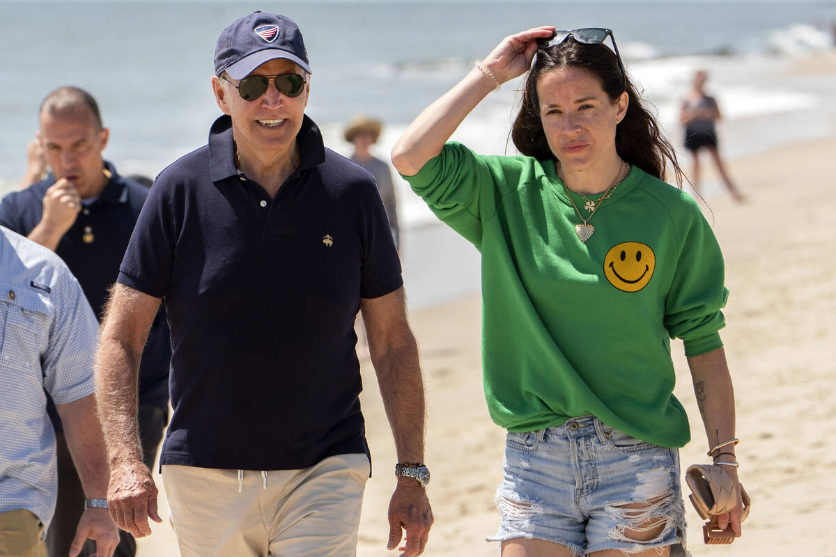 FILE — President Joe Biden walks on the beach with daughter Ashley Biden, in Rehoboth Beach, ...