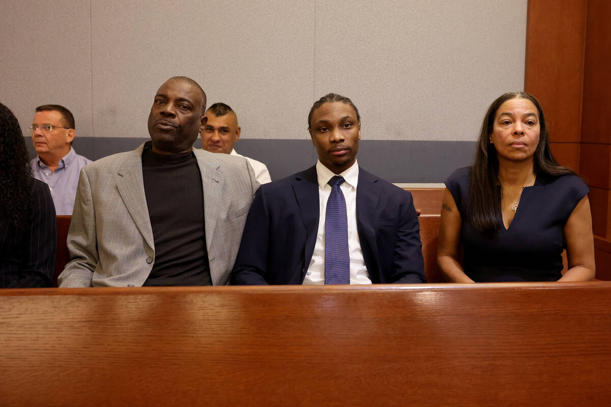 Former Raiders player Henry Ruggs, center, waits in court for a hearing at the Regional Justice ...