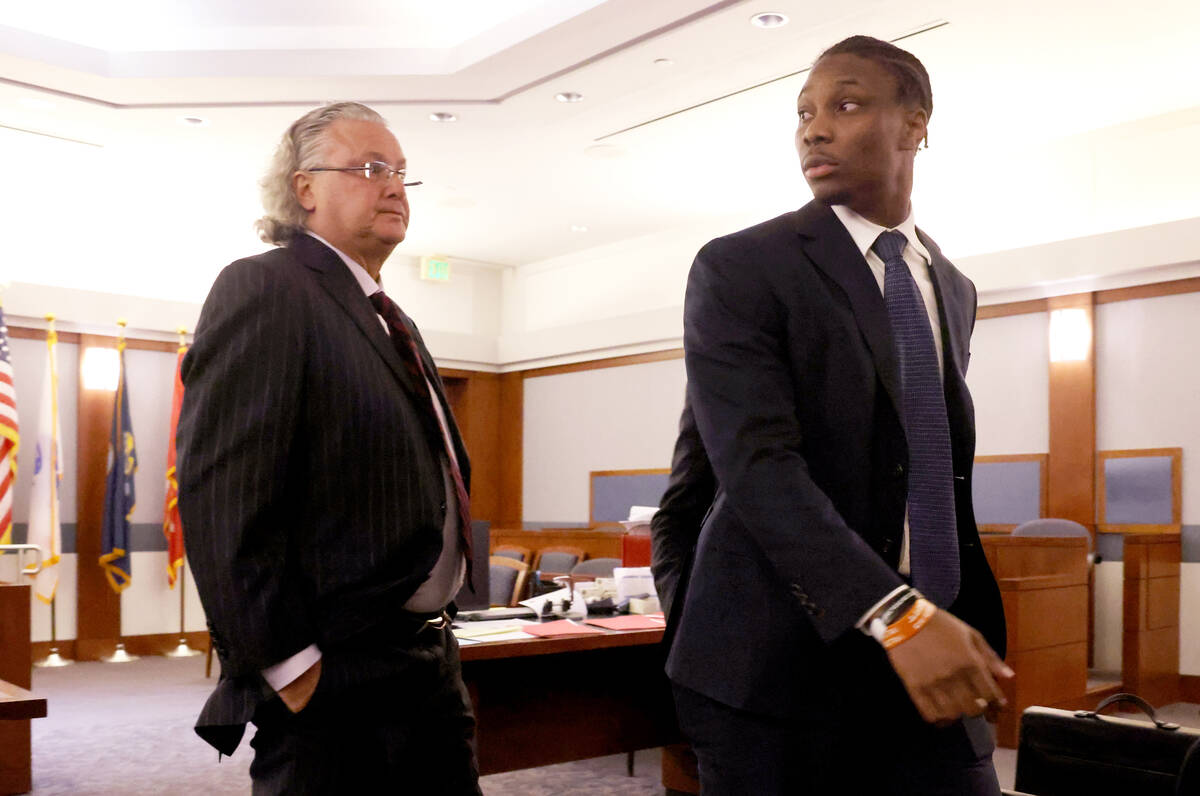 Former Raiders player Henry Ruggs, right, walks out of the courtroom with his attorney David Ch ...